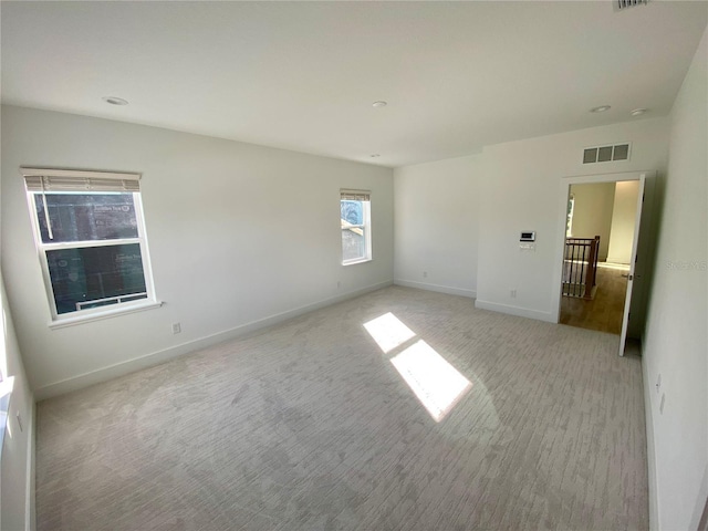 58 Overleaf Ln, Orlando, FL 32839 - spare room featuring baseboards and light carpet