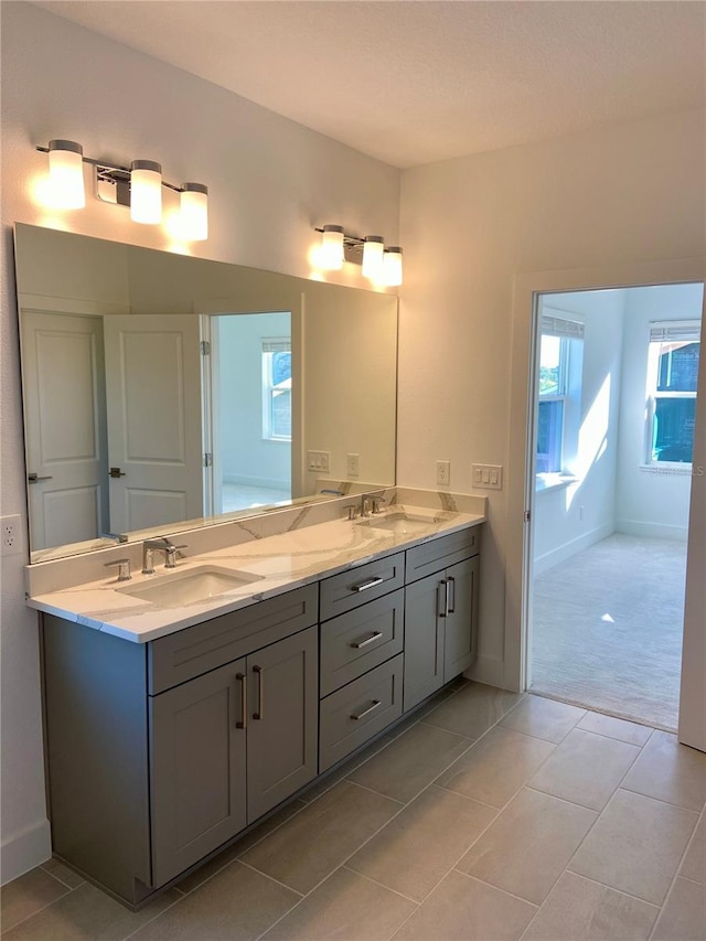 bathroom with vanity and tile patterned floors