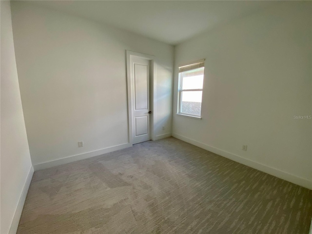 58 Overleaf Ln, Orlando, FL 32839 - carpeted spare room with baseboards
