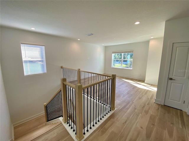 58 Overleaf Ln, Orlando, FL 32839 - stairway featuring wood finished floors, baseboards, and recessed lighting