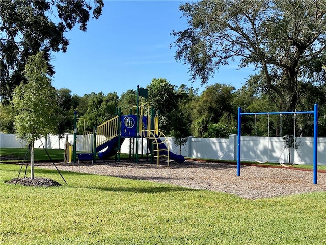 view of playground with a yard