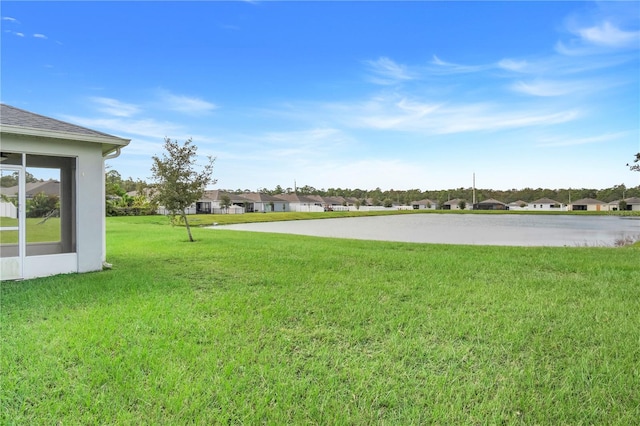 view of yard with a water view