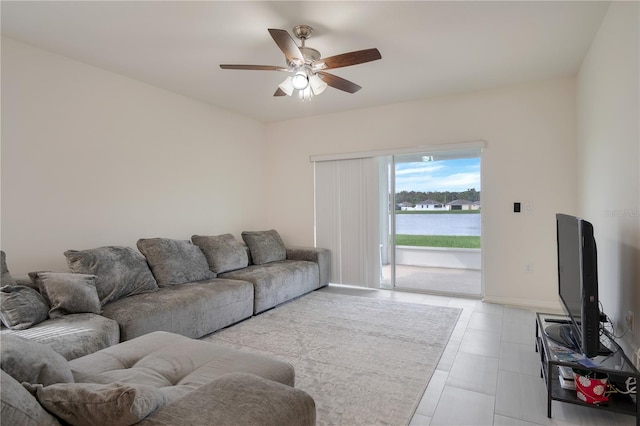 tiled living room with ceiling fan