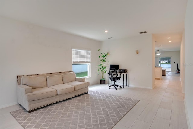 living room with ceiling fan