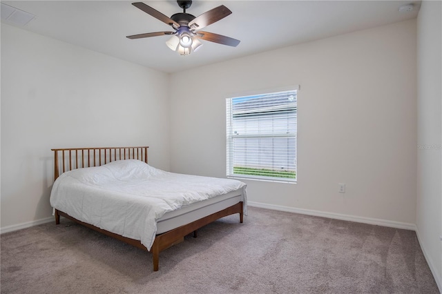 bedroom featuring ceiling fan and light colored carpet