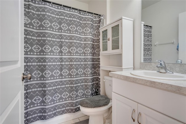 bathroom with vanity, toilet, tile patterned floors, and curtained shower