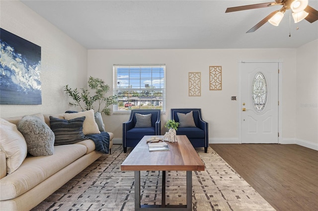 living room with hardwood / wood-style floors and ceiling fan