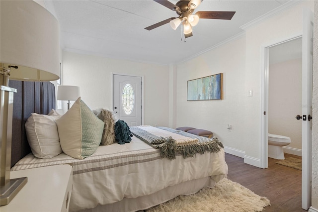 bedroom with connected bathroom, ornamental molding, ceiling fan, and dark hardwood / wood-style flooring