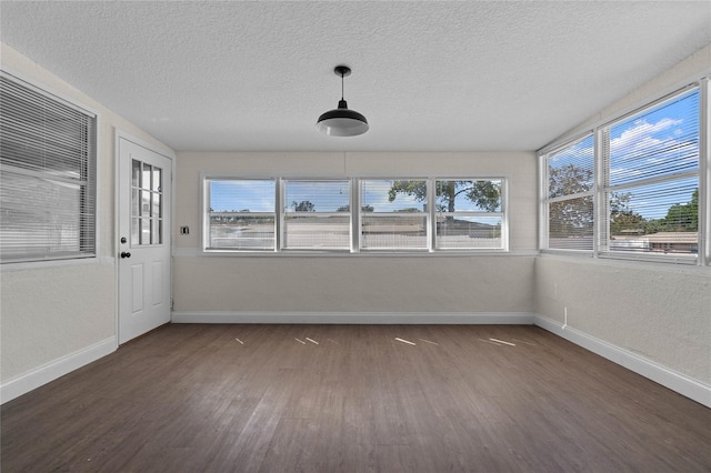 unfurnished sunroom featuring a wealth of natural light