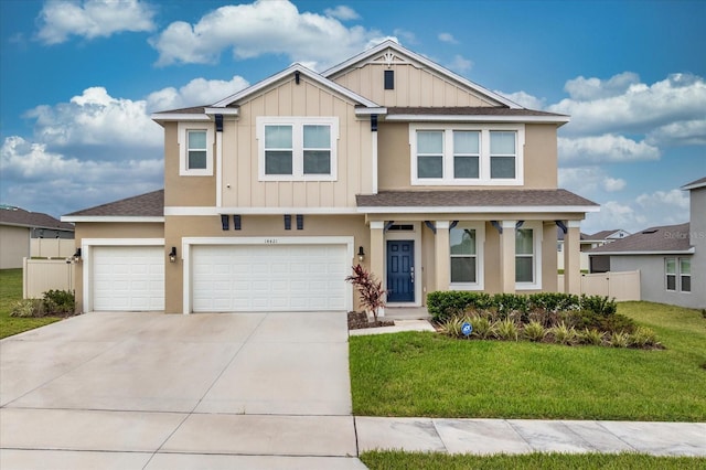 view of front facade with a front yard and a garage