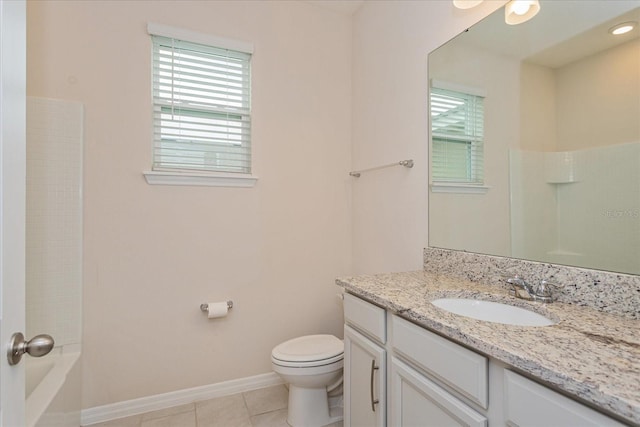 bathroom featuring vanity, toilet, and tile patterned flooring