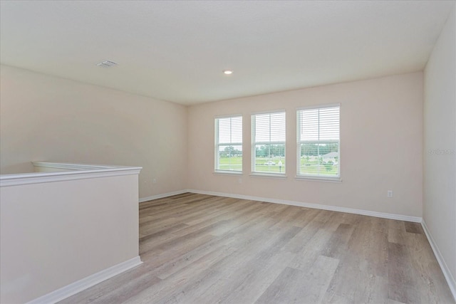 unfurnished room featuring light wood-type flooring