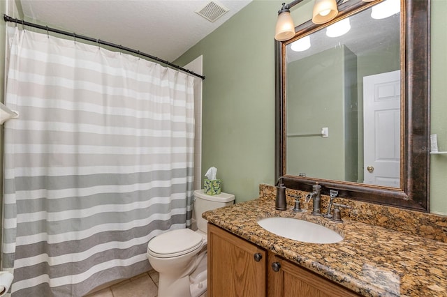 bathroom featuring toilet, a textured ceiling, vanity, and tile patterned floors