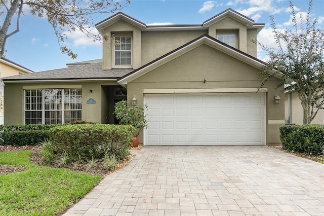 front facade with a garage