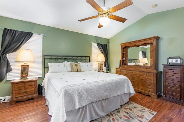 bedroom with hardwood / wood-style floors, ceiling fan, and lofted ceiling