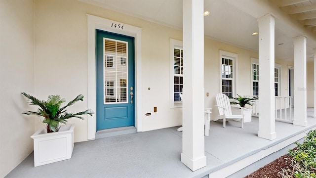 property entrance featuring covered porch