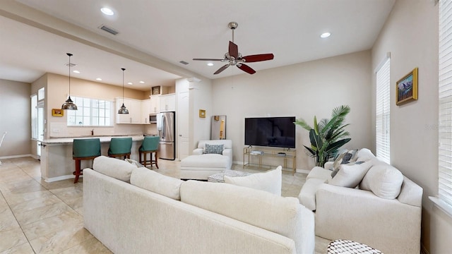 living room with ceiling fan