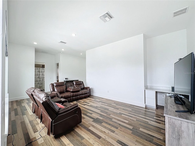 living room featuring dark hardwood / wood-style floors and built in desk