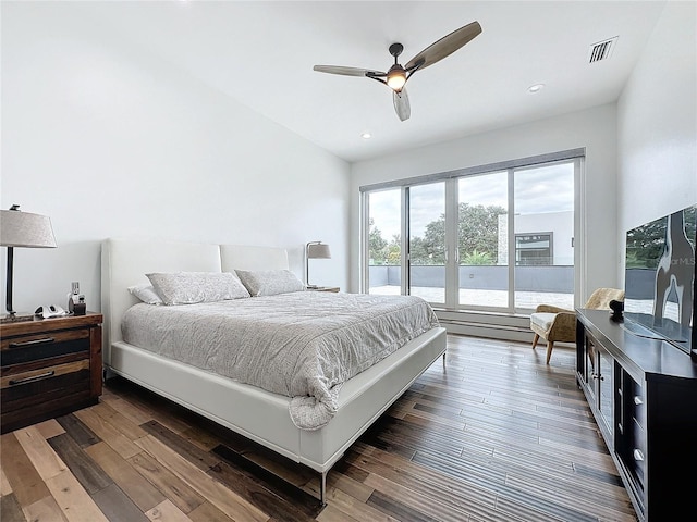 bedroom featuring a baseboard radiator, dark wood-type flooring, and ceiling fan