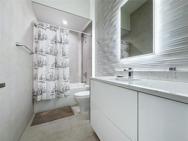 full bathroom with shower / bath combination with curtain, toilet, tile patterned floors, and vanity