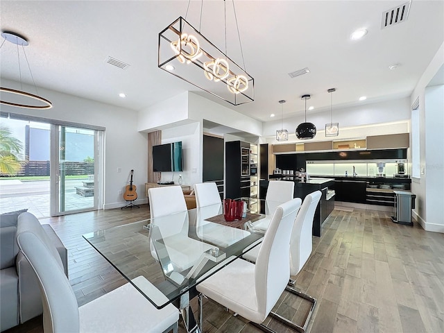 dining space with light hardwood / wood-style flooring