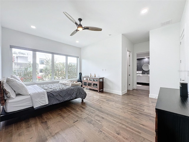 bedroom with hardwood / wood-style floors and ceiling fan