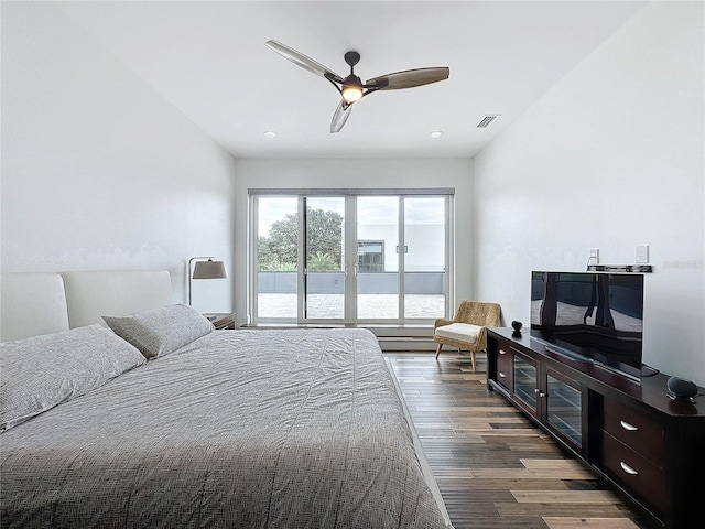 bedroom featuring ceiling fan and dark hardwood / wood-style floors