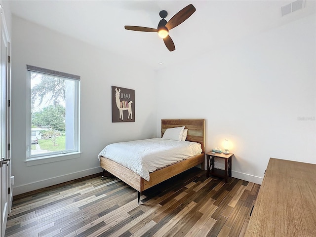 bedroom with hardwood / wood-style flooring and ceiling fan