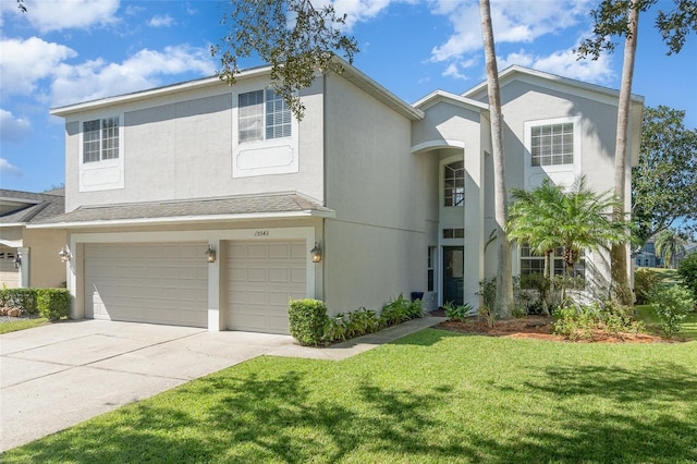 view of front of home with a front lawn and a garage