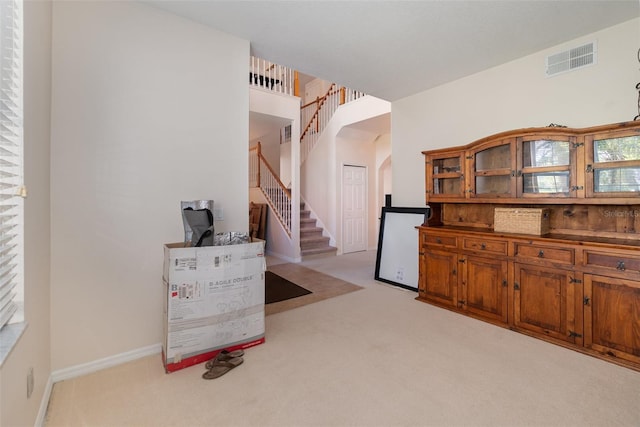 kitchen featuring light carpet