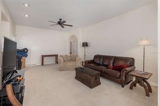 living room featuring light carpet and ceiling fan