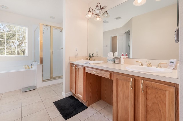 bathroom featuring vanity, independent shower and bath, and tile patterned floors