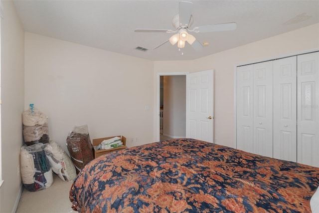 carpeted bedroom with a closet and ceiling fan