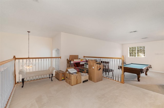 rec room featuring a textured ceiling, light colored carpet, and billiards