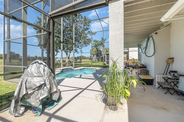 view of pool featuring a patio area and glass enclosure