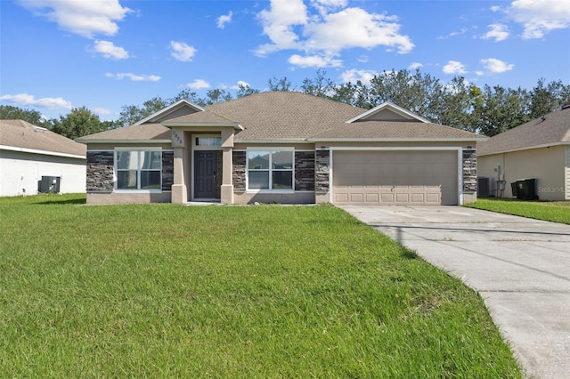 single story home featuring central AC, a front lawn, and a garage