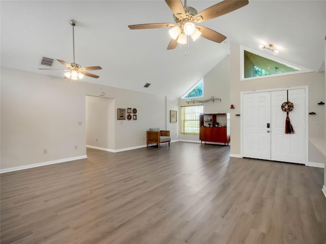 foyer entrance featuring wood-type flooring, high vaulted ceiling, and ceiling fan