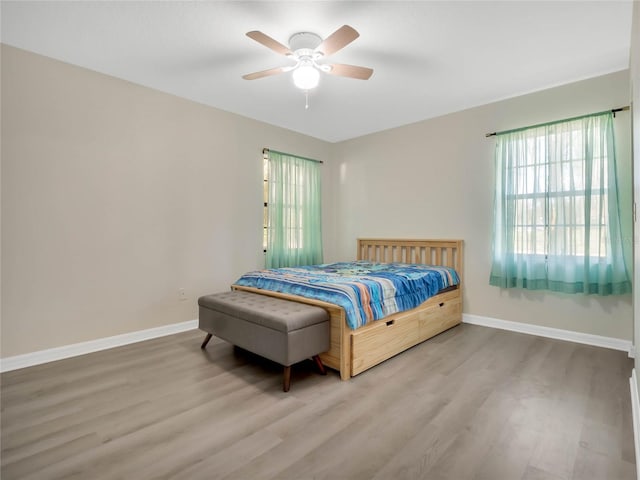 bedroom featuring wood-type flooring and ceiling fan