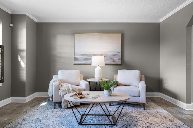 living area with crown molding, a textured ceiling, and wood-type flooring