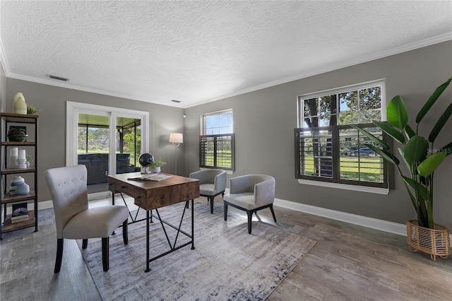 office area featuring crown molding, a textured ceiling, and hardwood / wood-style flooring