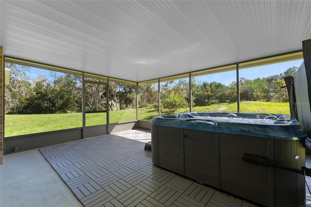 sunroom / solarium with a hot tub