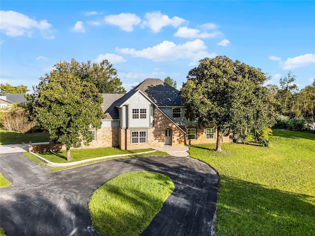 view of front of property with a front lawn