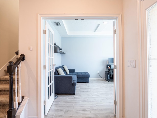 hall with light hardwood / wood-style floors