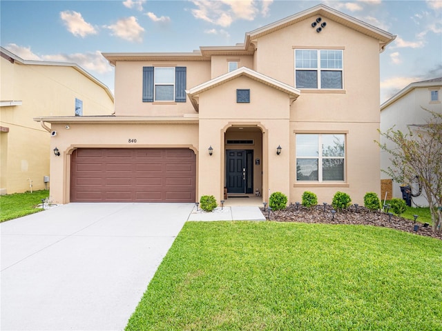 view of front of home with a front lawn and a garage