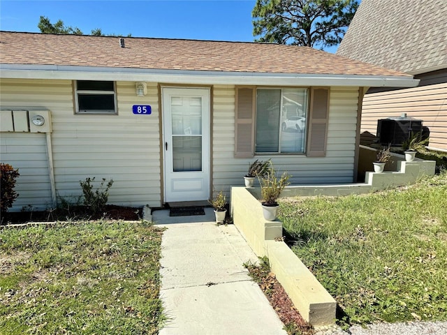 10301 US Highway 27 Unit 85, Clermont, FL 34711 - view of exterior entry featuring roof with shingles