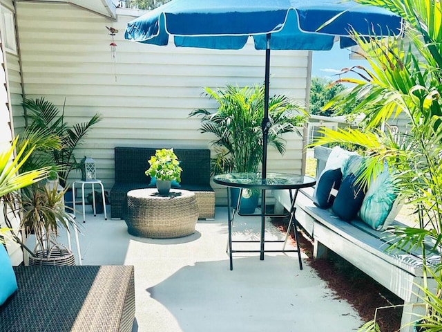 balcony with a patio area and outdoor lounge area