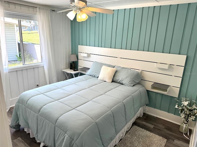 bedroom featuring ceiling fan and dark hardwood / wood-style flooring