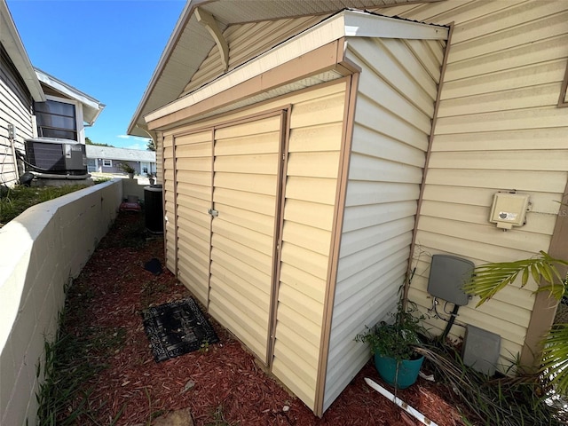 view of side of home featuring central AC