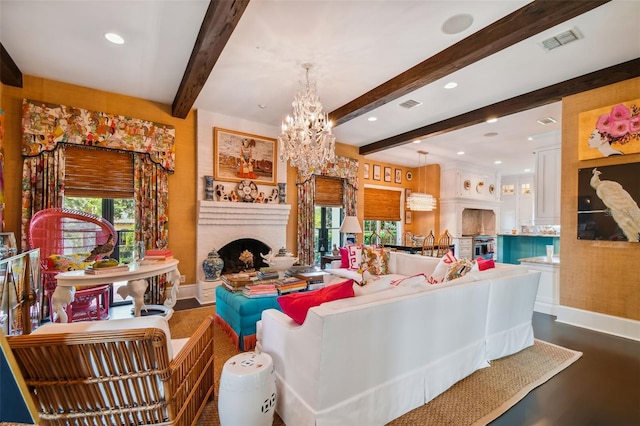 living room featuring beam ceiling and a notable chandelier