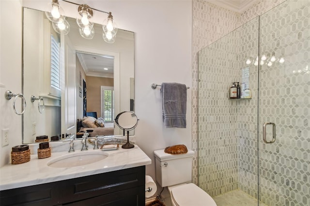 bathroom featuring vanity, crown molding, toilet, and an enclosed shower